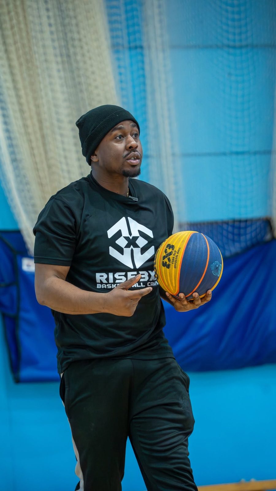 Afiz Olaniyan coaching with a ball in hand