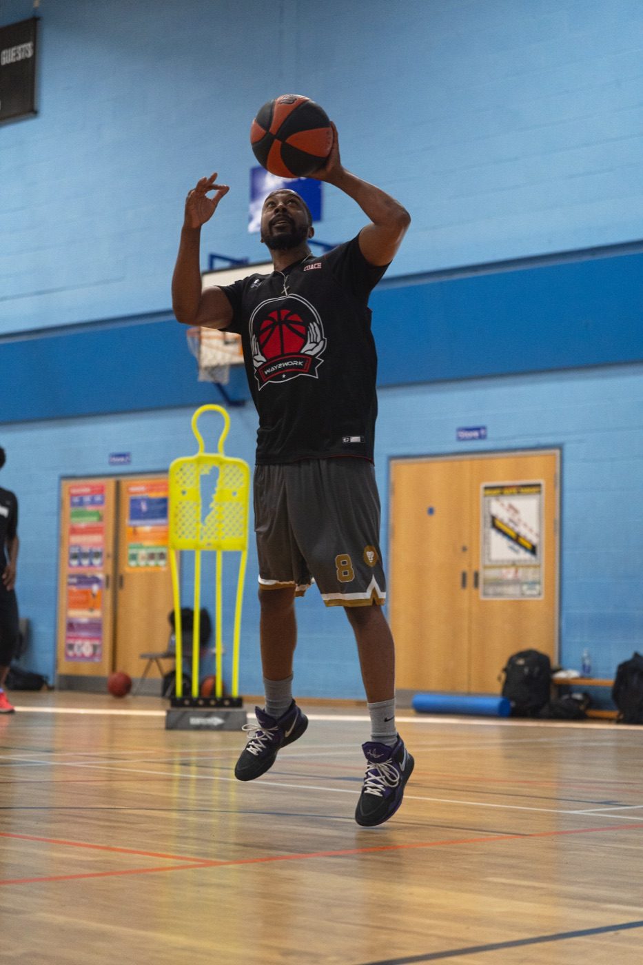 Player rising into a jump shot