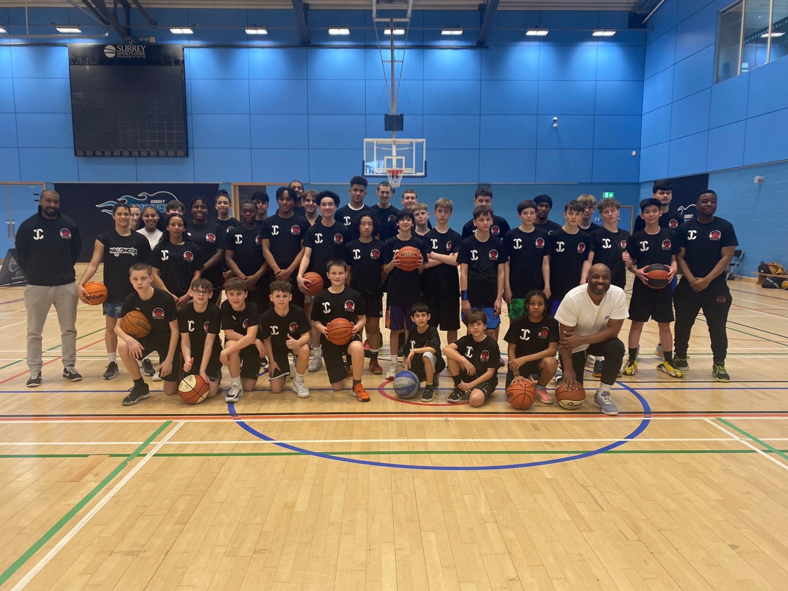 Way2Work players and coaches lined up on court